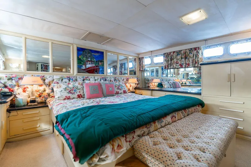 Slide: The Image of Luxurious bedroom interior of 1965 De Vries Lentsch 64 Motoryacht with floral decor and ample storage. - 54