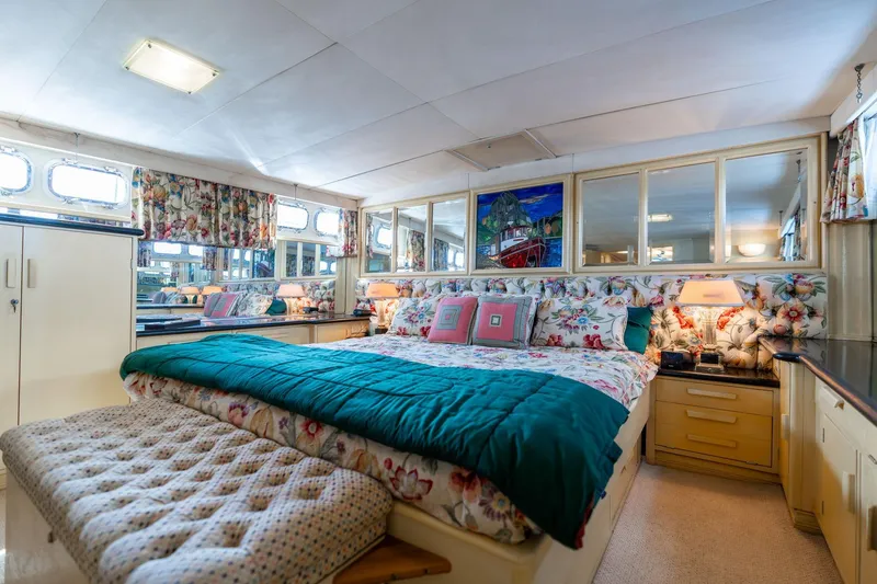 Slide: The Image of Luxurious bedroom interior of 1965 De Vries Lentsch 64 Motoryacht with floral decor and ample lighting. - 55