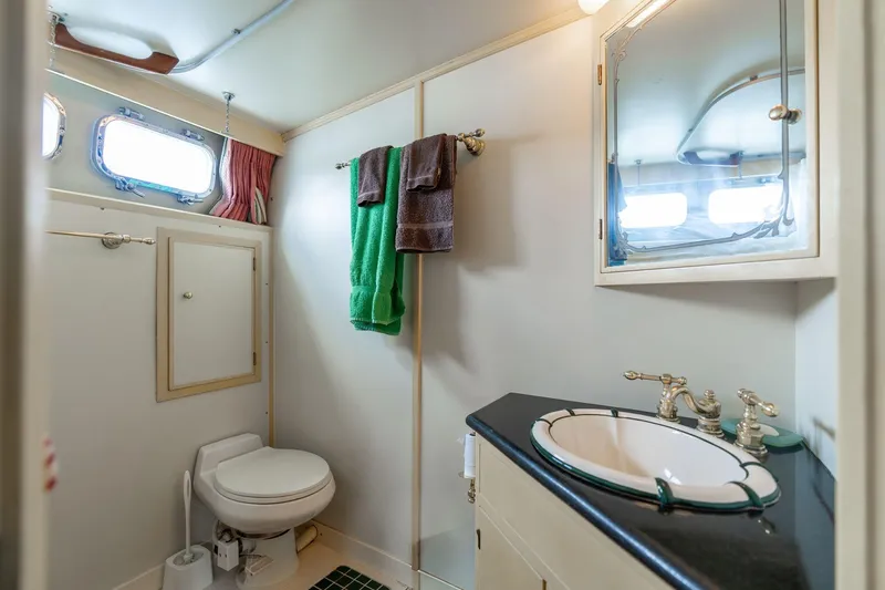 Slide: The Image of Bathroom interior of 1965 De Vries Lentsch 64 Motoryacht with sink and porthole windows. - 56