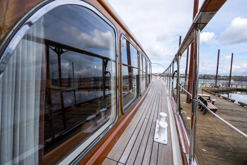 Slide: The Image of Side view of 1965 De Vries Lentsch 64 Motoryacht docked at a marina. - 58