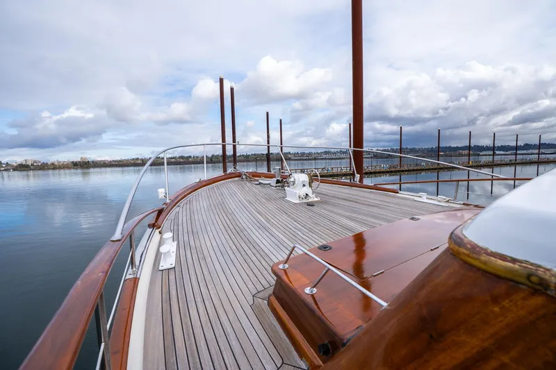 Slide: The Image of Vintage 1965 De Vries Lentsch 64 Motoryacht deck with wooden finish on calm water. - 65