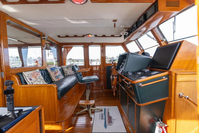Slide: The Image of Interior of 1965 De Vries Lentsch 64 Motoryacht with wooden accents and navigation equipment. - 7