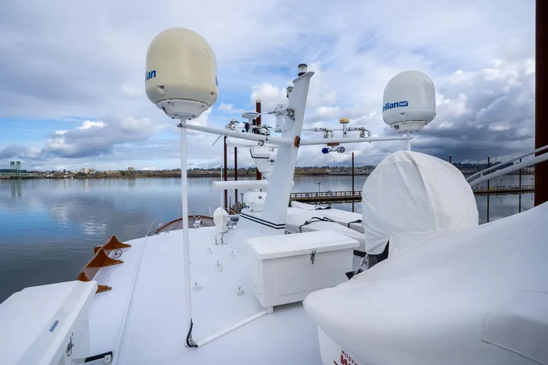 Slide: The Image of De Vries Lentsch 64 Motoryacht, 1965, featuring advanced radar equipment on a serene waterway. - 77
