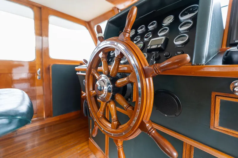 Slide: The Image of Wooden helm of 1965 De Vries Lentsch 64 Motoryacht with classic gauges. - 9