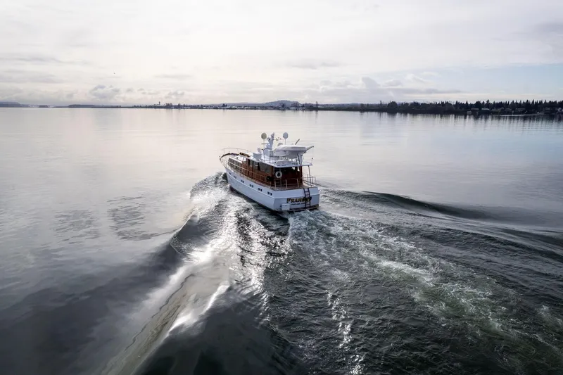 Slide: The Image of Vintage 1965 De Vries Lentsch 64 Motoryacht cruising on calm waters. - 96
