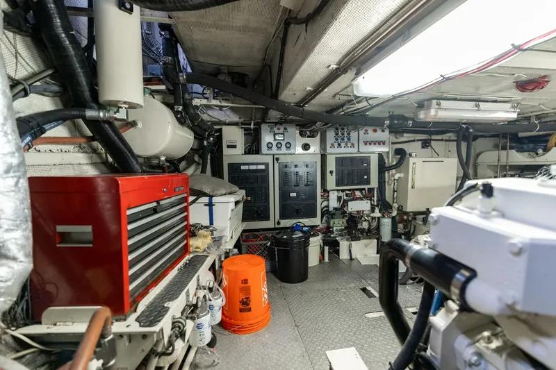 Slide: The Image of Engine room of a 1965 De Vries Lentsch 64 Motoryacht with control panels and tools. - 98