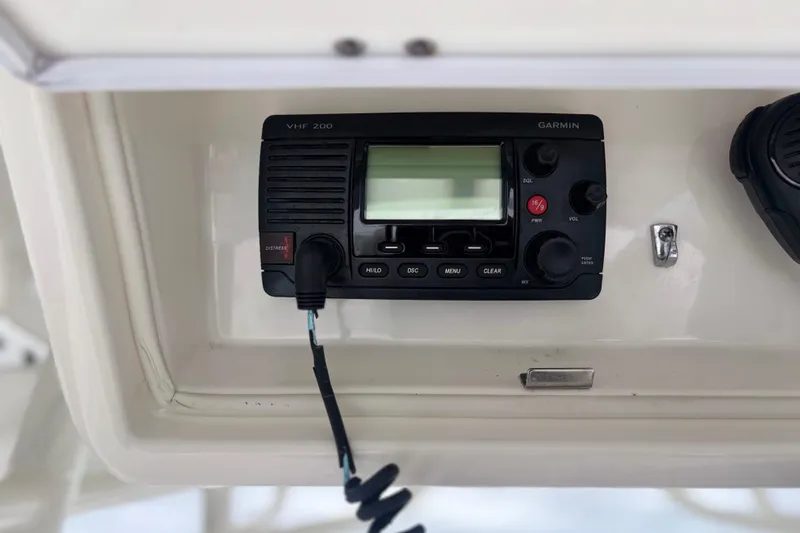 Slide: The Image of Garmin VHF 200 radio on 2017 Regulator 28 boat dashboard. - 26