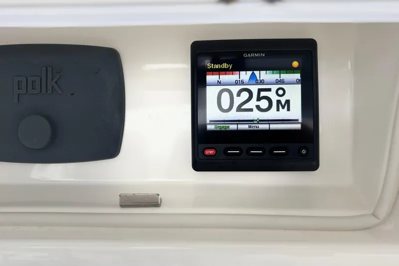 Slide: The Image of Garmin display on 2017 Regulator 28 boat dashboard, showing navigation data. - 28