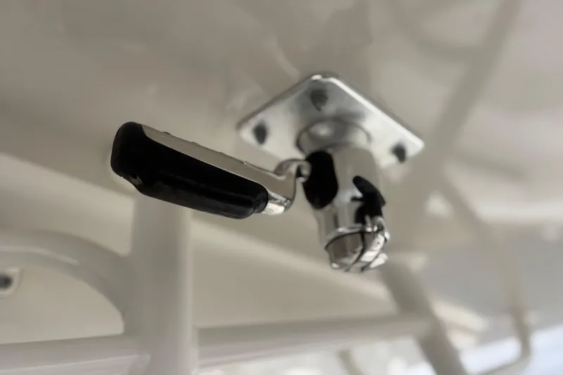 Slide: The Image of Close-up of a 2017 Regulator 28 boat component, featuring a metal handle and fixture. - 29