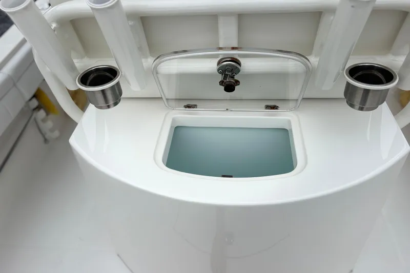 Slide: The Image of Livewell on 2017 Regulator 28 boat, featuring rod holders and cup holders. - 35