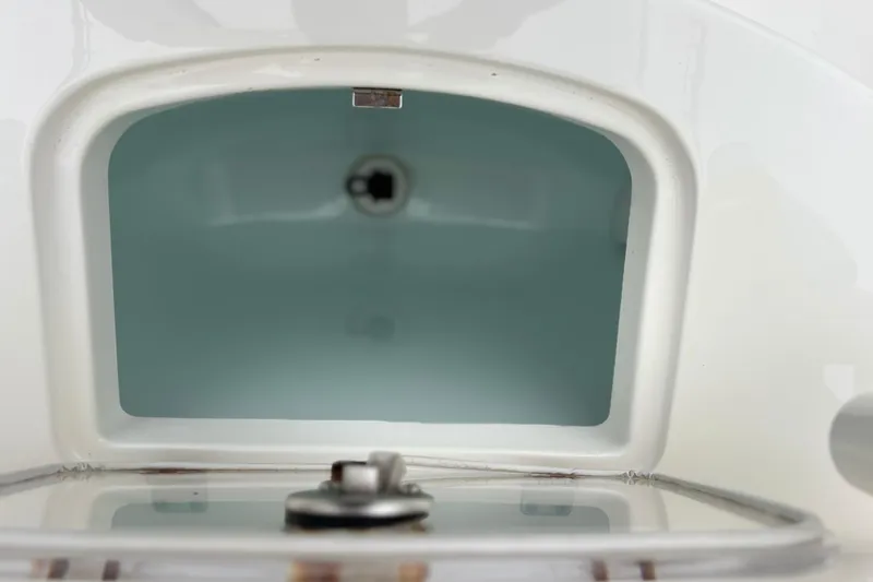 Slide: The Image of Open storage compartment on a 2017 Regulator 28 boat, showcasing interior space. - 36