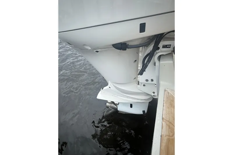 Slide: The Image of 2017 Regulator 28 boat engine in water, showcasing propeller and hull details. - 41