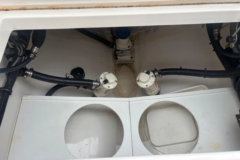 Slide: The Image of 2017 Regulator 28 boat compartment with hoses and fittings. - 43