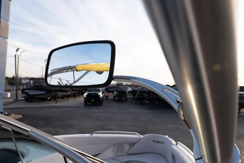 Slide: The Image of 2005 MasterCraft X10 boat with rearview mirror reflecting marina scene. - 14