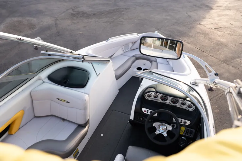 Slide: The Image of 2005 MasterCraft X10 boat interior with steering wheel and seating. - 20