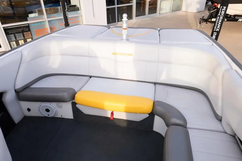 Slide: The Image of Interior of a 2005 MasterCraft X10 boat with white and yellow seating. - 22
