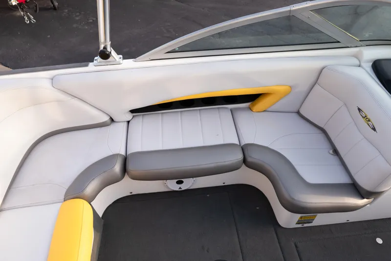 Slide: The Image of Interior seating of a 2005 MasterCraft X10 boat with gray and yellow accents. - 23