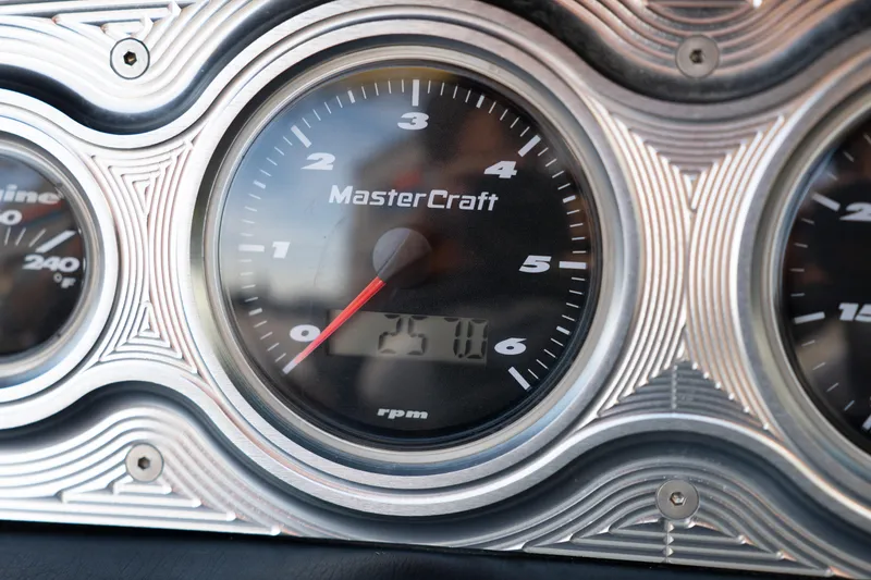 Slide: The Image of Close-up of a 2005 MasterCraft X10 boat tachometer displaying RPM. - 31