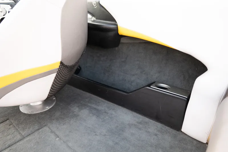 Slide: The Image of Interior of a 2005 MasterCraft X10 boat, featuring seating and storage area. - 40