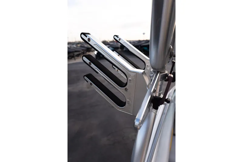 Slide: The Image of Close-up of a 2005 MasterCraft X10 boat's wakeboard rack in a marina setting. - 45