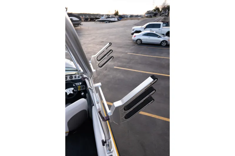 Slide: The Image of 2005 MasterCraft X10 boat with wakeboard rack in parking lot. - 46