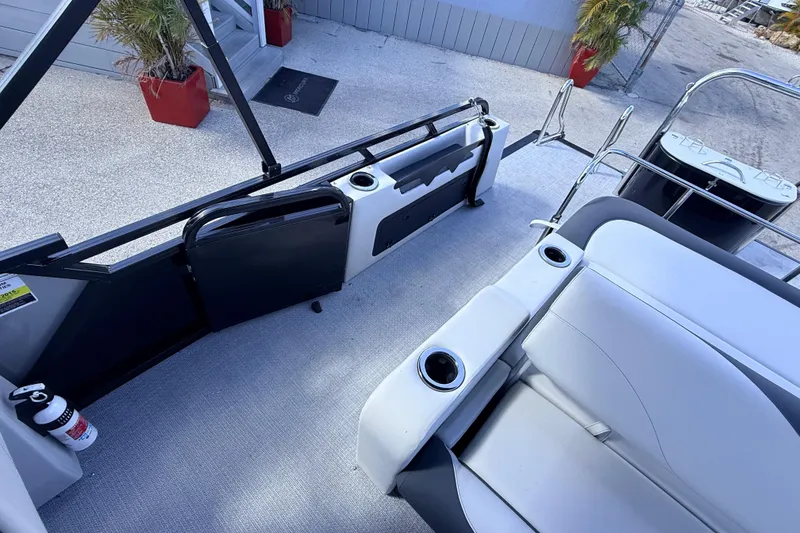 Slide: The Image of 2026 Avalon 2385 LSZ Versatile Rear Bench, Tri Toon interior with seating and cup holders. - 21