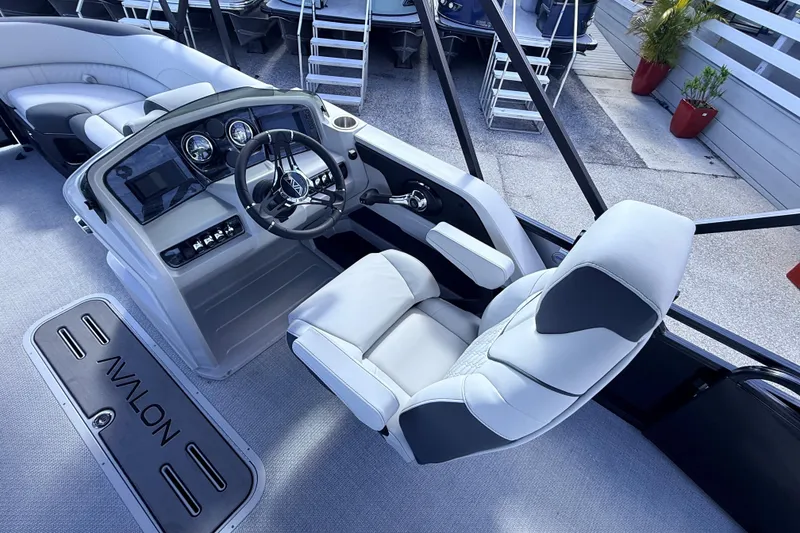 Slide: The Image of 2026 Avalon 2385 LSZ Versatile Rear Bench boat interior with modern helm and seating. - 22