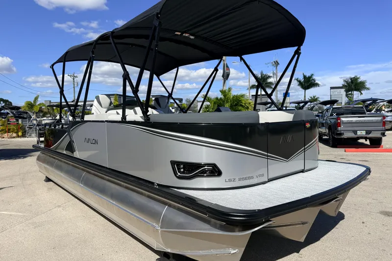 Slide: The Image of 2026 Avalon 2385 LSZ Versatile Rear Bench Tri Toon boat with high-performance features. - 5
