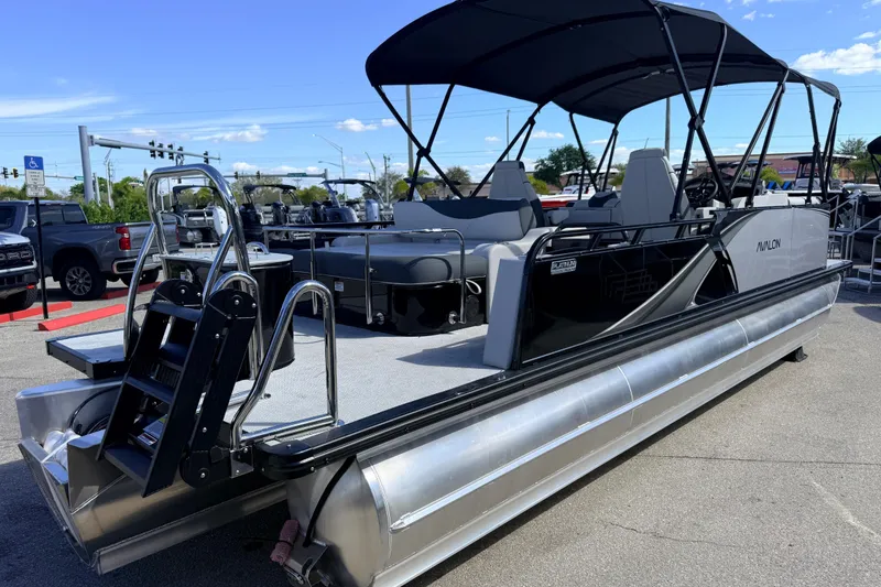 Slide: The Image of 2026 Avalon 2385 LSZ Versatile Rear Bench Tri Toon boat with high-performance features. - 6