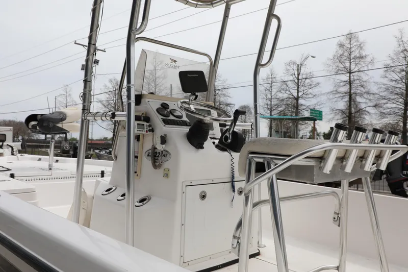 Slide: The Image of 2006 Skeeter ZX22 Bay T boat console with steering wheel and fishing rod holders. - 4
