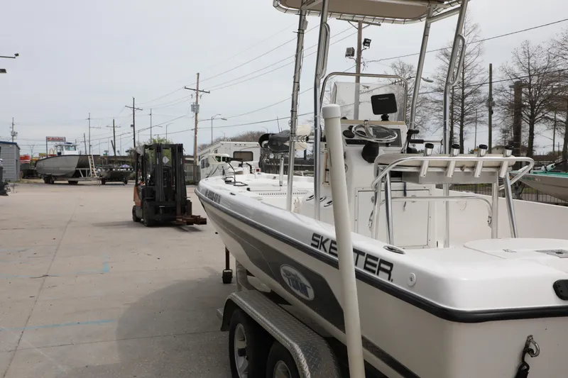 Slide: The Image of 2006 Skeeter ZX22 Bay T boat on trailer in outdoor storage area. - 6