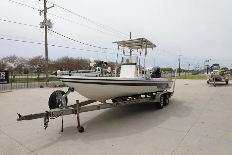 Slide: The Image of 2006 Skeeter ZX22 Bay T boat on trailer in outdoor setting. - 7