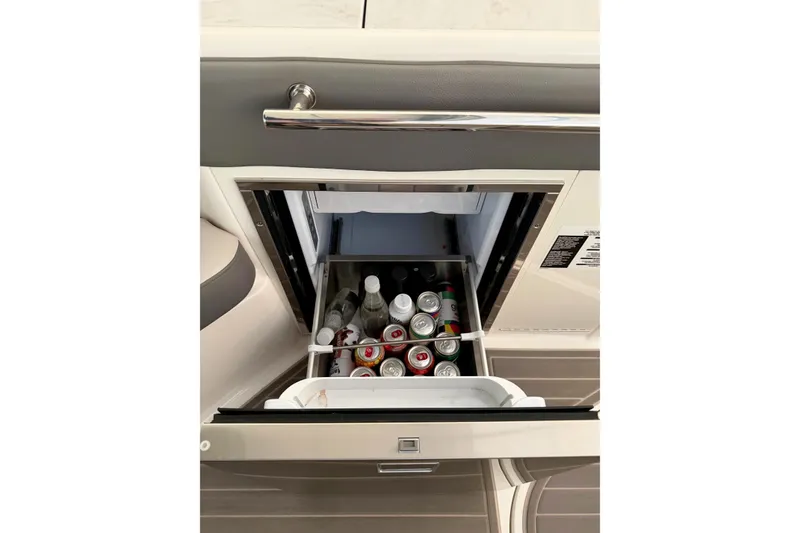 Slide: The Image of Mini fridge stocked with beverages on 2023 Sea Ray Sundancer 320 Coupe yacht. - 13