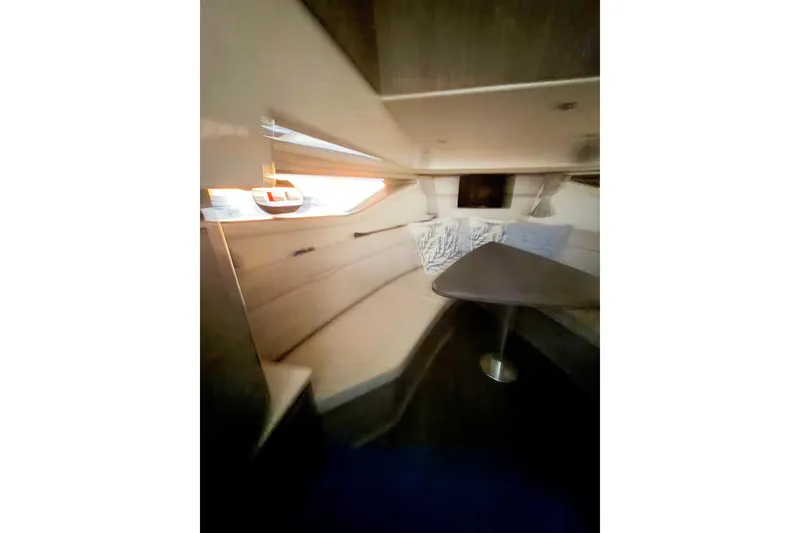Slide: The Image of Interior of 2023 Sea Ray Sundancer 320 Coupe, featuring cozy seating and modern design. - 17