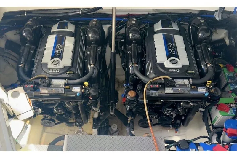 Slide: The Image of Twin engines of 2023 Sea Ray Sundancer 320 Coupe, showcasing powerful 6.2L 350 horsepower. - 21