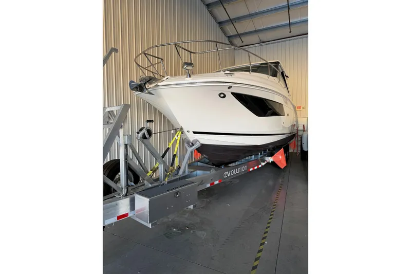Slide: The Image of 2023 Sea Ray Sundancer 320 Coupe on trailer in storage facility. - 3