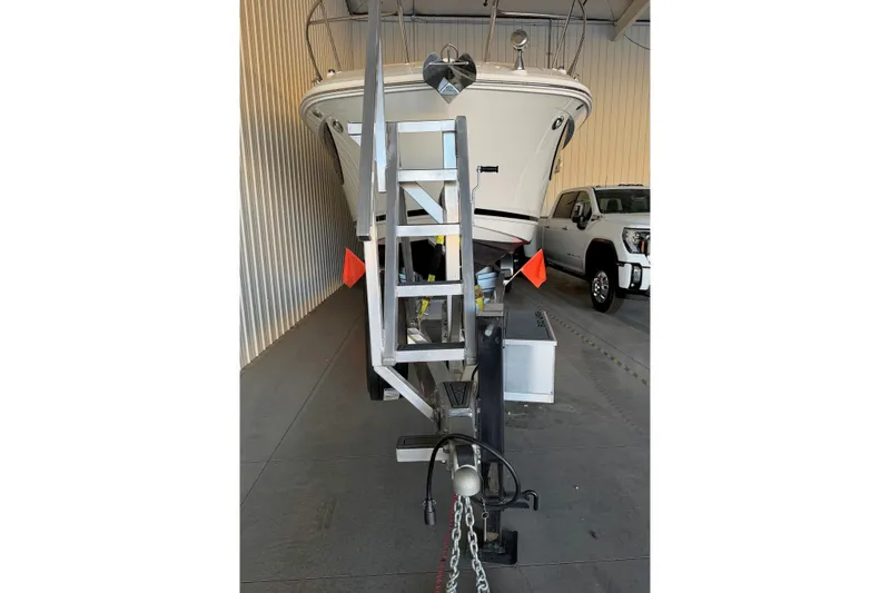 Slide: The Image of 2023 Sea Ray Sundancer 320 Coupe on trailer in storage facility. - 5