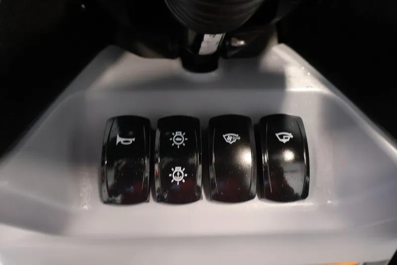 Slide: The Image of Control panel of 2026 Sea-Doo Switch Cruise Limited 18 with four black switches. - 19