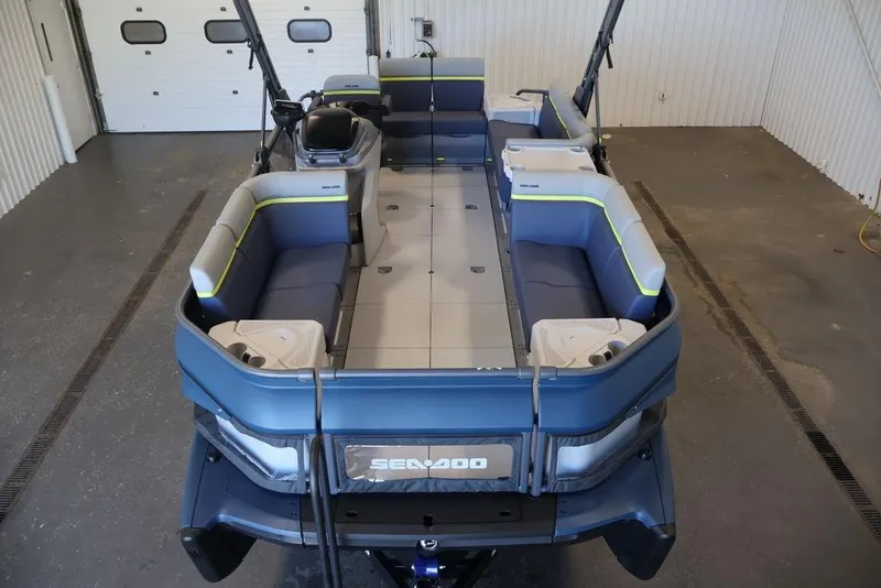 Slide: The Image of 2026 Sea-Doo Switch Cruise Limited 18 pontoon boat in a garage setting. - 8