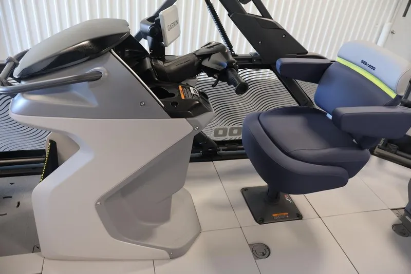 Slide: The Image of 2026 Sea-Doo Switch Cruise Limited 18 cockpit with Garmin navigation and comfortable seating. - 13