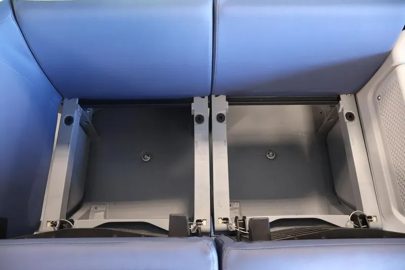 Slide: The Image of 2026 Sea-Doo Switch Cruise Limited 18 storage compartment with blue seating. - 11