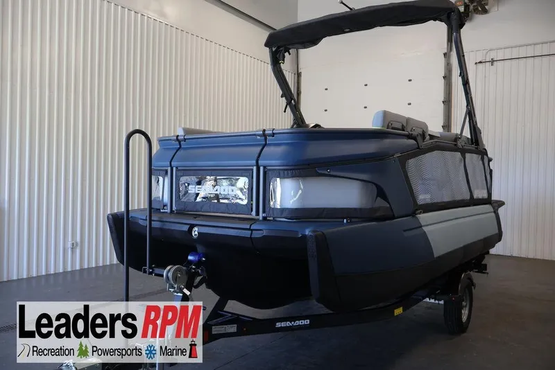 The Image of 2026 Sea-Doo Switch Cruise Limited 18 pontoon boat in showroom, Leaders RPM branding visible. - 1