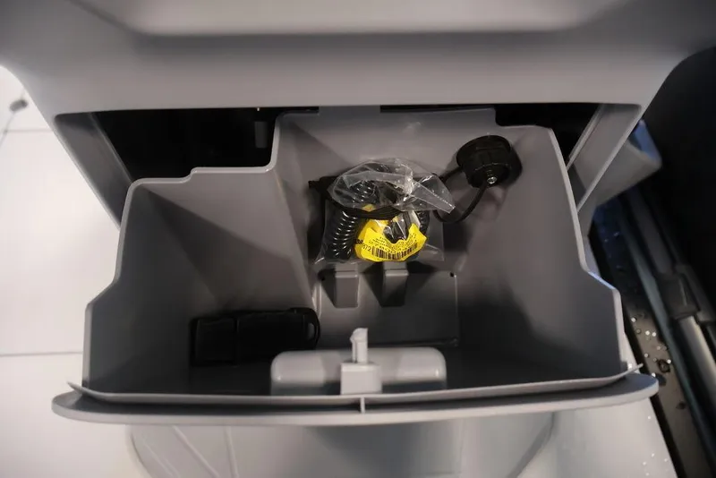Slide: The Image of Storage compartment of 2026 Sea-Doo Switch Cruise Limited 18 with accessories inside. - 27