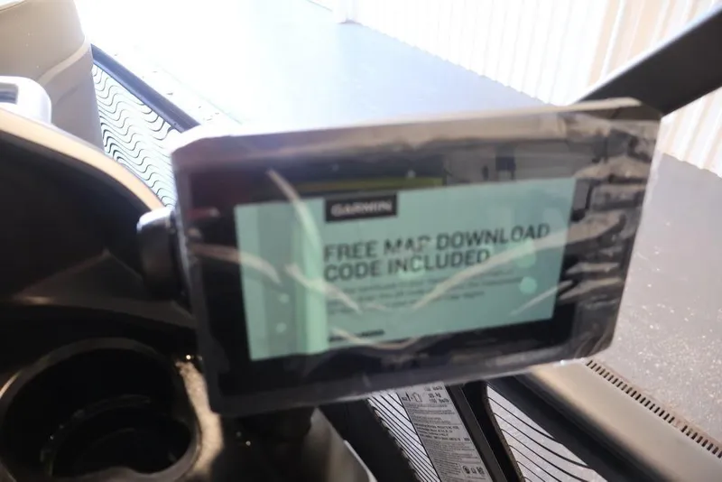 Slide: The Image of 2026 Sea-Doo Switch Cruise Limited 18 dashboard with Garmin map download code display. - 20