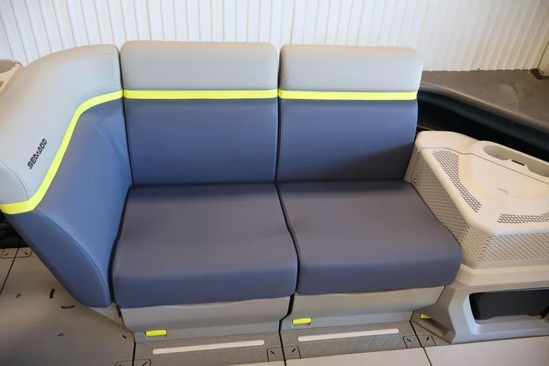 Slide: The Image of 2026 Sea-Doo Switch Cruise Limited 18 seating with modern design and vibrant accents. - 12