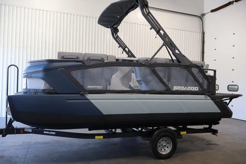Slide: The Image of 2026 Sea-Doo Switch Cruise Limited 18 pontoon boat on trailer in indoor setting. - 9