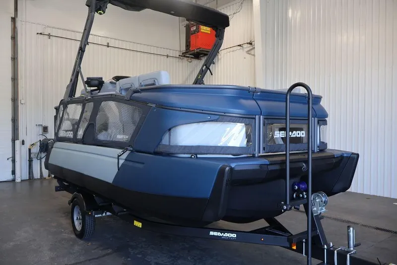 Slide: The Image of 2026 Sea-Doo Switch Cruise Limited 18 in a garage, showcasing sleek design and modern features. - 3