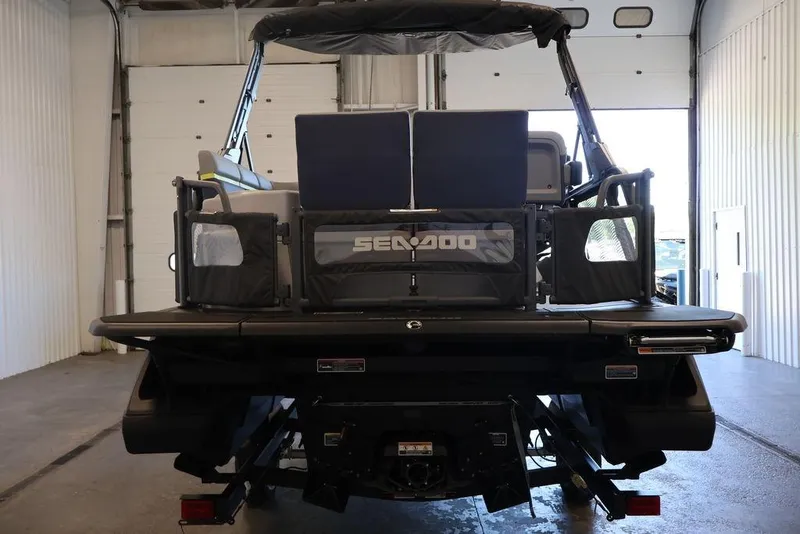 Slide: The Image of 2026 Sea-Doo Switch Cruise Limited 18 in a garage, rear view. - 4