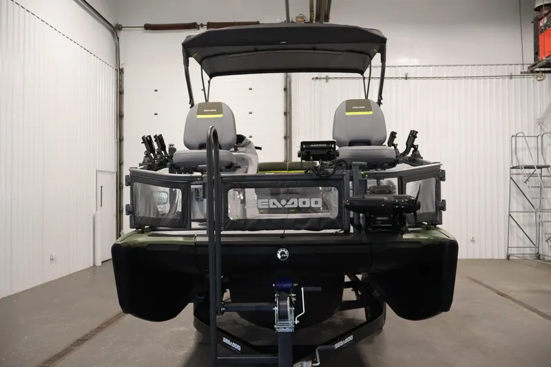 Slide: The Image of 2026 Sea-Doo Switch Fish 18 pontoon boat in a garage setting. - 9