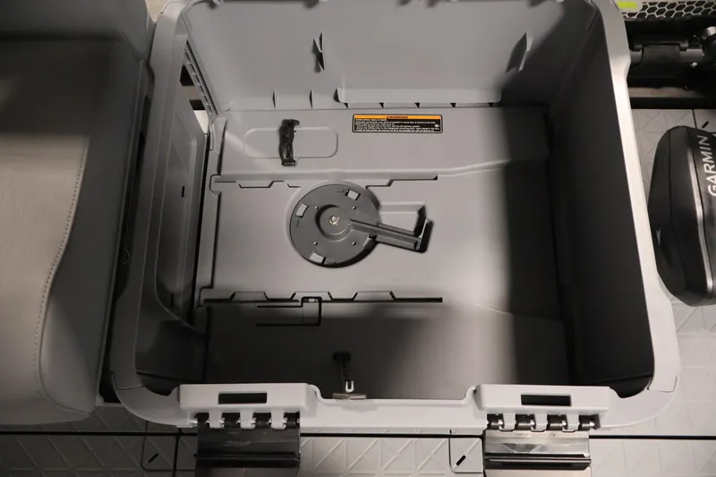 Slide: The Image of Interior storage compartment of 2026 Sea-Doo Switch Fish 18, featuring a secure latch system. - 27